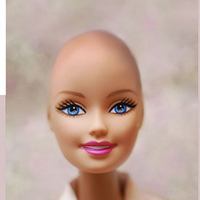 Новая версия куклы Барби приободрит детей, больных раком 